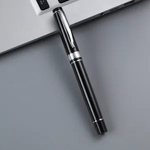 Sleek black metal rollerball pen with silver clip and Greek key band for business sign.