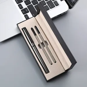 Close up view of luxury metal ballpoint pen gift set with black box and two refills.