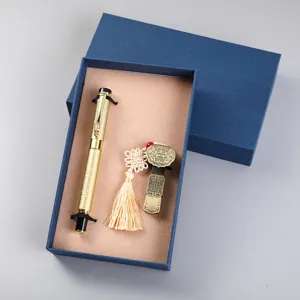 Close up view of the luxury metal dragon signature pen and Chinese knot bookmark gift set.