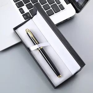 Detailed close-up view of a luxury metal ballpoint pen elegantly presented in a black gift box.