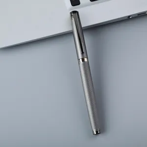 Grey metal rollerball pen detail shot, elegant engraved pattern and sleek clip design.