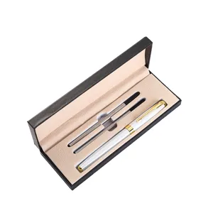 Business metal gift pen set with white gold trim pen and two refills in a black box.