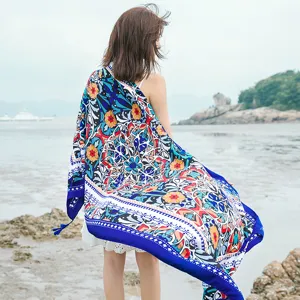 Detailed view of bohemian floral print beach towel scarf, ideal for summer holiday and travel.