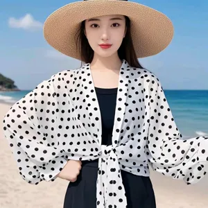 Wide sleeve polka dot sun protection cover-up shawl detail view, breathable lightweight fabric.