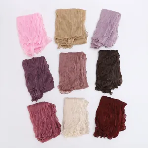 Detail view of women lightweight crinkled lace headscarf shawl multi color variety.