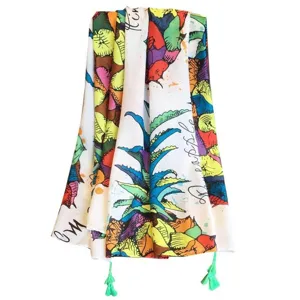 Colorful pineapple print bohemian beach towel with stylish tassels for summer vacation.
