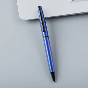 Detailed close-up view of a sleek blue metal ballpoint pen with black clip for office.