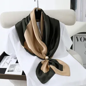 Elegant two-tone silk square scarf with pearl ring detail, versatile fashion accessory.