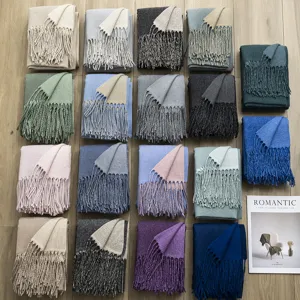 Detailed close-up view of winter double-sided solid color cashmere feel tassel scarves.