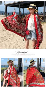 Detailed view of the red ethnic style beach shawl showing vibrant vintage floral prints.