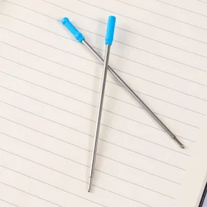 Metal ballpoint pen refill with blue cap, detail shot showing the smooth metallic design.