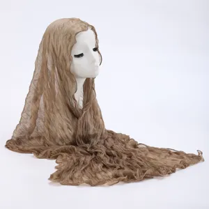 Brown crinkled sheer scarf detailed view, lightweight gauze shawl for sun protection.