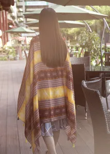 Detail view of the ethnic print tassel shawl, outdoor travel photography scene for women.