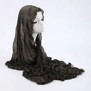 Detail view of dark brown crinkled sheer headscarf shawl fabric texture and drape effect.