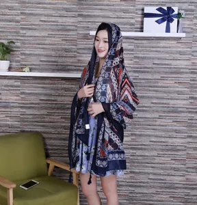 Women ethnic style print linen scarf shawl with tassels for summer sunshade travel photography.