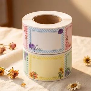 Detail view of watercolor floral blank label stickers roll, decorative self-adhesive planner labels.