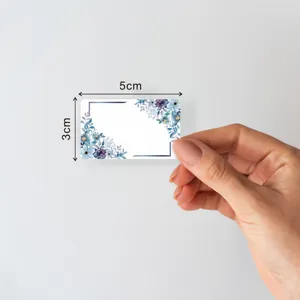 Watercolor floral blank label sticker detail showing 5x3cm compact size and elegant botanical border.
