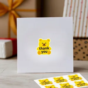 Jolis autocollants ours jaune de remerciement pour emballage et scellement artisanal.
