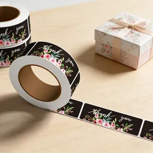 Roll of thank you stickers with floral design for gift sealing and packaging decoration.