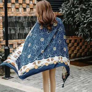 Women vintage chain patterned scarf shawl, elegant blue silk fabric with stylish tassels.