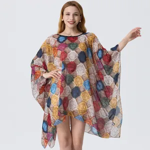 Detailed view of the colorful 3D printed loose beach cover-up with lightweight sheer fabric.