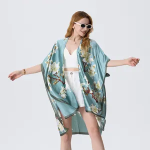 Light blue floral kimono beach cover-up, elegant silk shawl and loose summer outer wear.