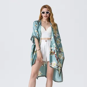 Light blue floral kimono cardigan, stylish beach cover-up and elegant silk-like shawl.