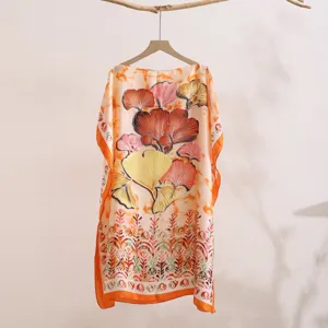 Detailed shot of summer imitation silk sun protection shawl featuring ginkgo leaf print.