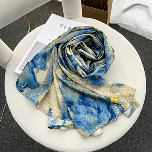 Elegant blue and yellow abstract satin silk scarf, fashionable women's shawl for autumn.