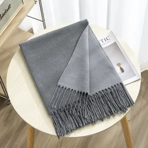 Cozy grey double-sided cashmere-feel tassel scarf for women, warm winter fashion accessory.