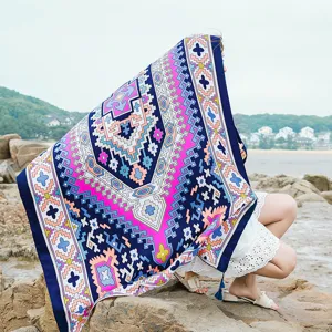 Vibrant ethnic geometric print beach towel scarf for women, stylish oversized travel shawl.