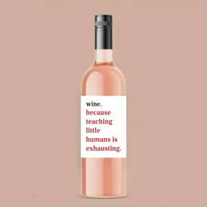 Close-up detail of funny quote custom wine bottle label sticker with white design.