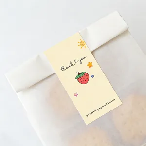 Cute thank you sticker detail on bakery packaging, strawberry and star design, self-adhesive.