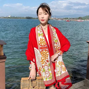Chic ethnic style red cotton linen shawl scarf detail, perfect for travel photography and sun protection.