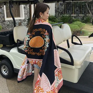 Detailed view of the vintage ethnic style oversized shawl scarf with delicate retro floral prints.
