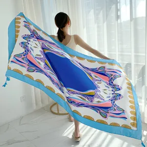Stunning large silk scarf and beach shawl featuring vibrant blue and pink baroque floral prints.