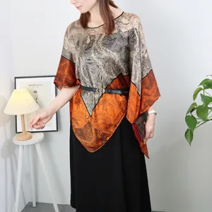 Detailed view of the stylish imitation silk printed poncho top, loose summer cover-up.