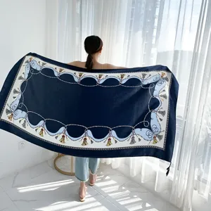 Elegant navy blue silk scarf with tassel and chain print, perfect spring/summer shawl.