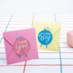 Gender reveal party stickers set with pink and yellow cute envelopes for baby shower celebration.