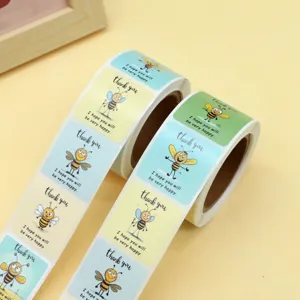Roll of cute cartoon bee thank you stickers for baking, handmade packaging and gifts.