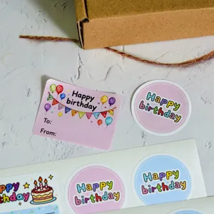 Birthday sealing stickers roll, gift wrapping labels with cute balloons and cake designs for gifts.