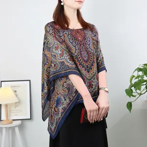 Detailed view of women's paisley print imitation silk pullover shawl, loose summer top.
