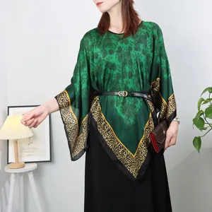 Green printed silk poncho shawl top with leopard border and stylish black belt for women.