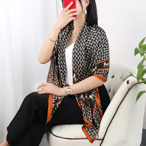 Fashion black and white silk square scarf with orange border and chic chain print for women.