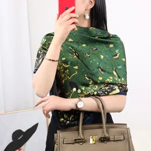 Green silk scarf for women featuring elegant bird and foliage print, luxury fashion accessory.