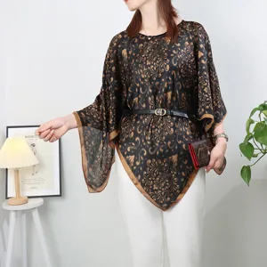 Details of black and gold baroque printed silk pullover shawl, lightweight summer cover-up.