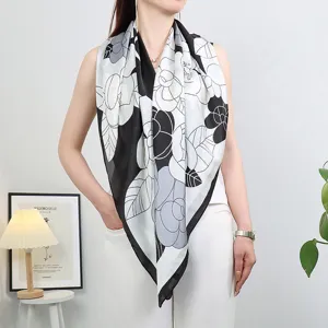 Silk scarf detail showing black and white camellia floral print design for women fashion accessory