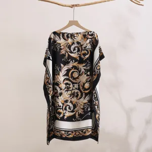 Detailed display of the luxury baroque printed summer beach cover-up and elegant shawl top.