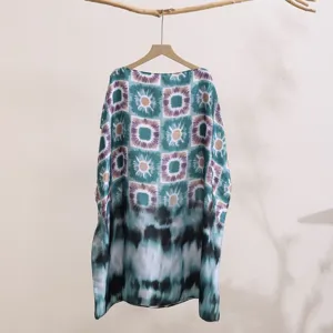 Detailed view of loose printed sun protection shawl, elegant geometric tie-dye fabric.
