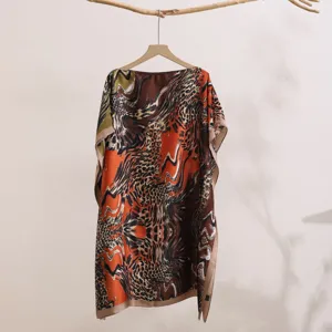 Detailed view of women loose printed sun protection shawl cape with boat neck design.